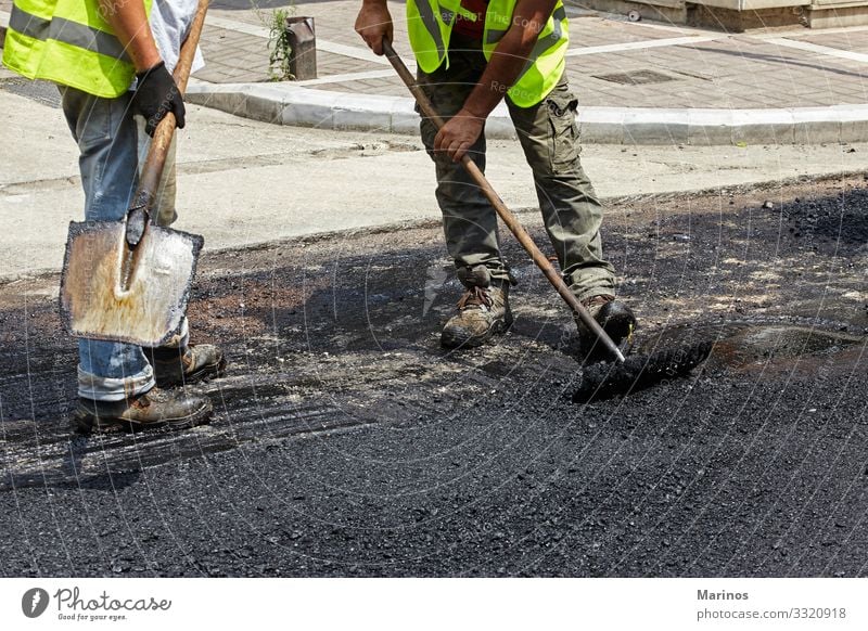 Workers using asphalt paver tools during road construction. Work and employment Industry Machinery Building Transport Street Highway Vehicle New Maintenance