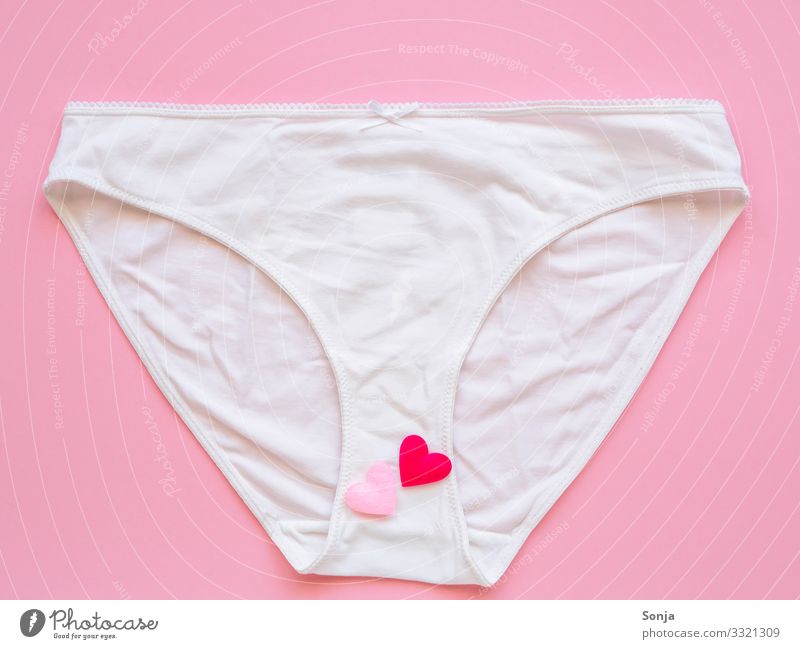 White women underpants with hearts on a pink background, top view, love - a  Royalty Free Stock Photo from Photocase