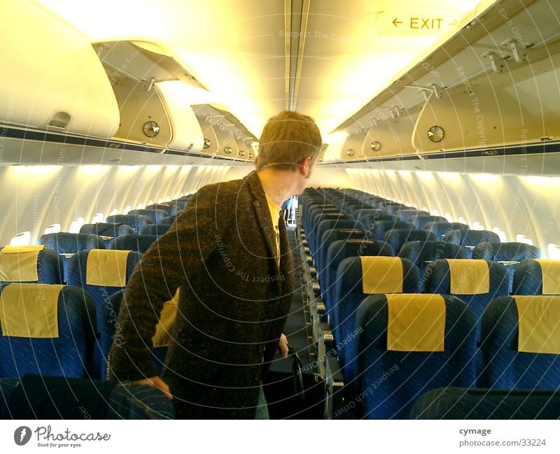 where did they all go...? Airplane Vacation & Travel Looking Coat Man Masculine Yellow Seating Aviation Row Backwards Human being Blue Look back Passenger plane