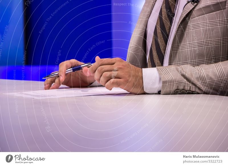 TV host reporter in studio, hands with pen and paper jurnalist TV set Human being Hand 1 18 - 30 years Youth (Young adults) Adults Media Television Suit Tie