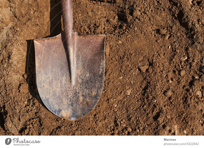 Shovel on soil backgound.Gardening. Work and employment Tool Nature Earth Sand Metal Brown shovel dig agriculture Ground Hole spring Mud Organic equipment Clay