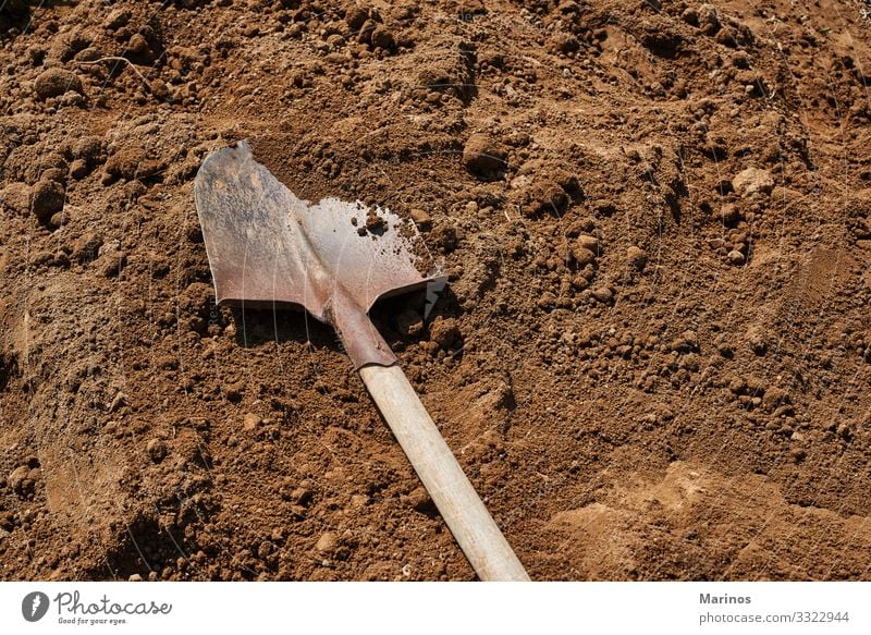 Shovel on soil backgound.Gardening. Work and employment Tool Woman Adults Nature Earth Sand Metal Brown shovel dig agriculture Ground Hole spring Mud Organic