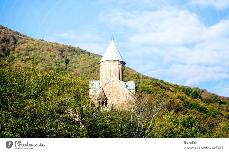 old antique christian church with a dome and a cross in a forest Vacation & Travel Tourism Mountain Nature Landscape Plant Sky Clouds Autumn Tree Forest Hill