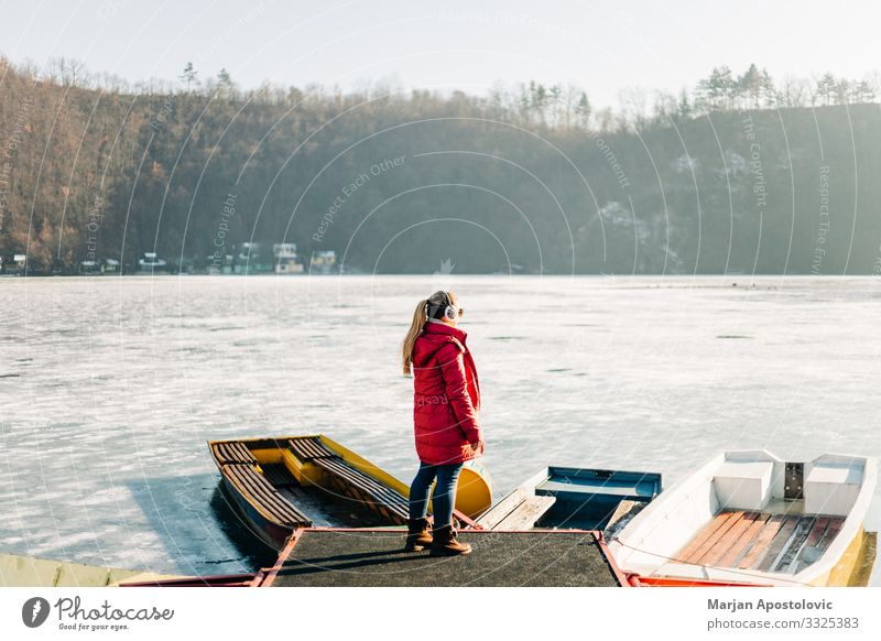 Boats in a frozen lake in winter time - a Royalty Free Stock Photo from  Photocase