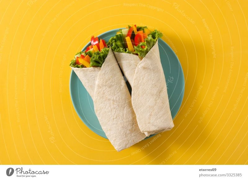 Vegetable tortilla wraps isolated on yellow background. Top view Wrap Roll Flat bread Food Healthy Eating Food photograph Spring Vegetarian diet Mix Carrot