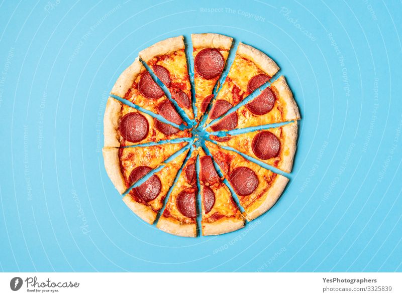 Sliced pizza pepperoni on blue background. Pizza salami slices Food Dough Baked goods Dinner Italian Food Delicious Gold Tradition Mediterranean food above view