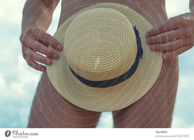 hat in the hands of a naked man closeup Skin Relaxation Summer Man Adults Hand Fingers Feet Sky Climate Clothing Hat Eroticism Hot Naked Blue Modest Beige