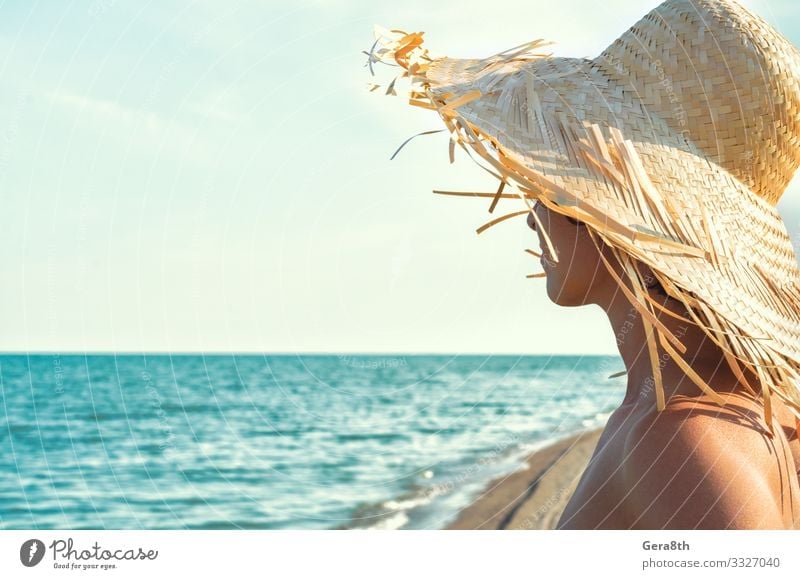 young girl in a straw hat on the background of the sea Body Skin Vacation & Travel Summer Beach Ocean Waves Woman Adults Nature Landscape Sky Clouds Horizon