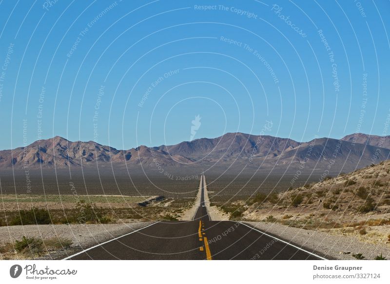 lonely road in Death Valley National Park in the USA Vacation & Travel Beach Environment Nature Landscape Sky Cloudless sky Climate Climate change Weather