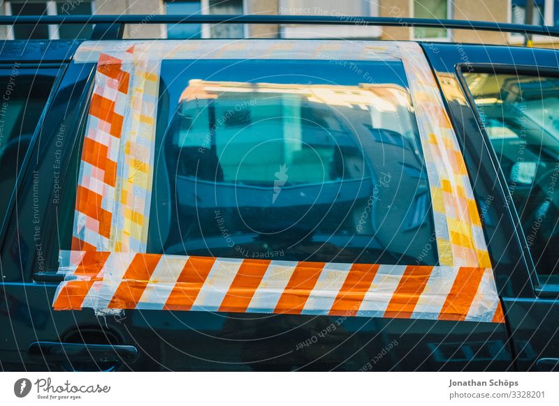 Car windows glued with barrier tape Town Transport Means of transport Passenger traffic Motoring Street Vehicle Anger Destruction Accident Car Window Warn Stick