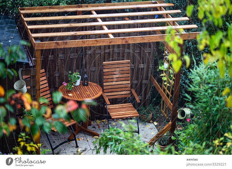 View of seating under wooden pergola in the garden Garden House (Residential Structure) Chair Terrace Table Seating Pérgola Summer Garden chair Autumn Rain