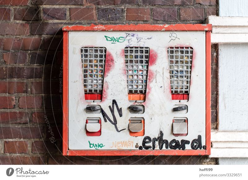 behind bars Building Wall (barrier) Wall (building) Gumball machine Vending machine Graffiti Soviet Union Old Esthetic Famousness Dirty Broken Kitsch Retro Town