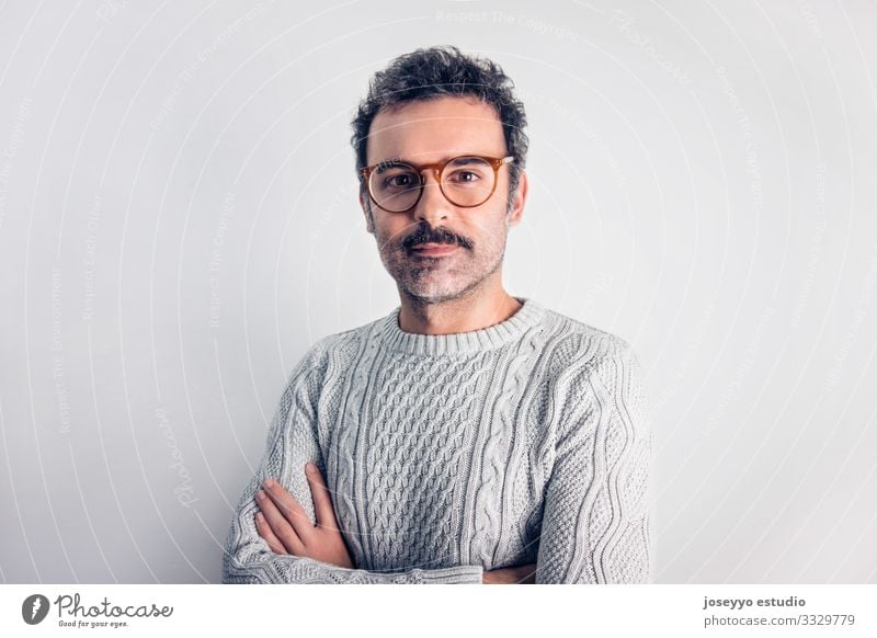 Man with mustache and glasses standing with crossed arms. Adults Attractive Brown Cancer Casual clothes Self-confident Cool (slang) Copy Space Expression Face