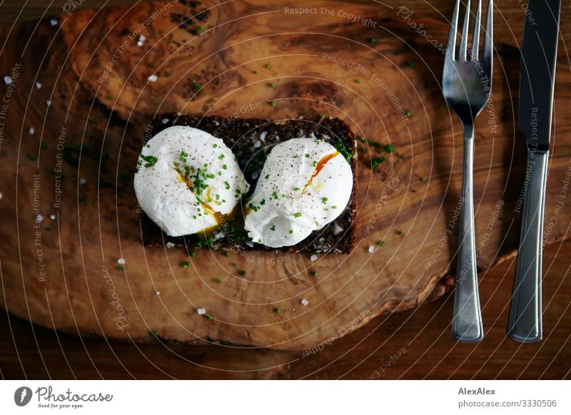 Two poached eggs on brown bread Food Bread Egg Whole grain bread Fork Knives Black bread Spicy Nutrition Breakfast Dinner Organic produce Slow food