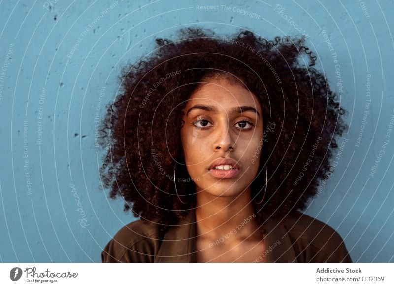 Young black woman looking at camera with intense look female sad portrait challenge african american young unhappy upset concerned despair frustration worry