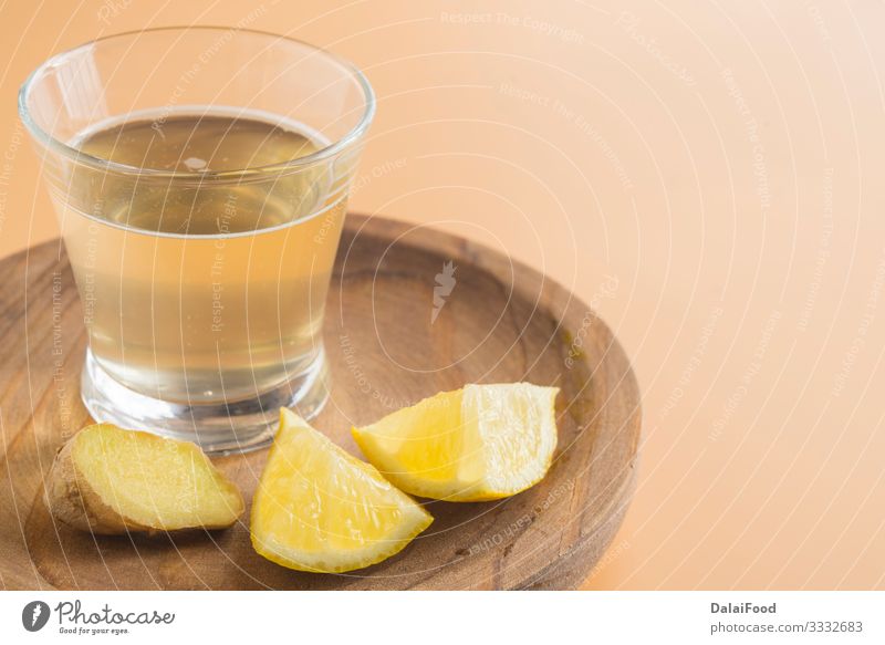 Kombucha of ginger and lemon in glass Juice Diet brown background drink infusion kombucha Lemon Organic Refreshment tea tree Front view