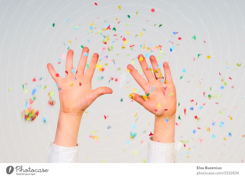 hands up Human being Feminine Child Girl Hand 1 8 - 13 years Infancy Party Birthday Confetti Emotions Joy Carnival Colour photo Studio shot Motion blur