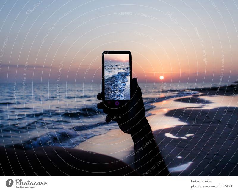 Man is taking a sunset photo on the cell phone Vacation & Travel Summer Beach Ocean Cellphone PDA Technology Adults Hand Environment Nature Landscape Sky Dark