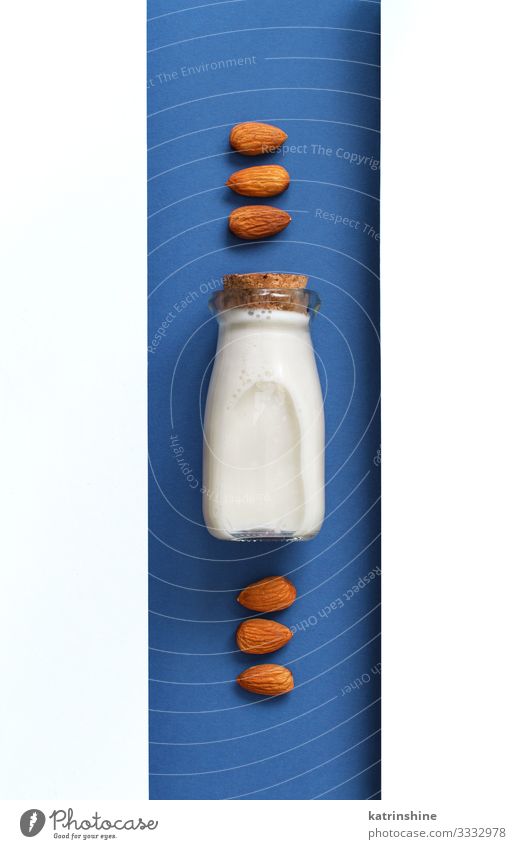 Vegan almond milk, non dairy alternative milk Vegetable Nutrition Breakfast Vegetarian diet Diet Beverage Bottle Spoon Fresh Natural Above Blue White