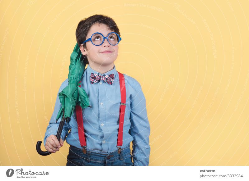 child with green umbrella Joy Winter Human being Child Boy (child) 1 8 - 13 years Infancy Clouds Autumn Climate Weather Bad weather Storm Rain Accessory