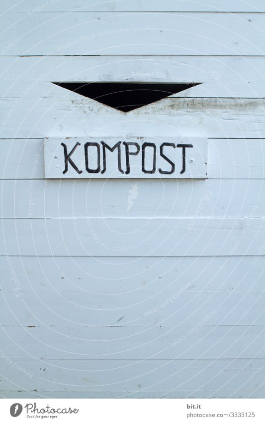 Compost lettering, on a sign of a waste container for waste separation on environmental protection and climate change. Trash composting Climate change