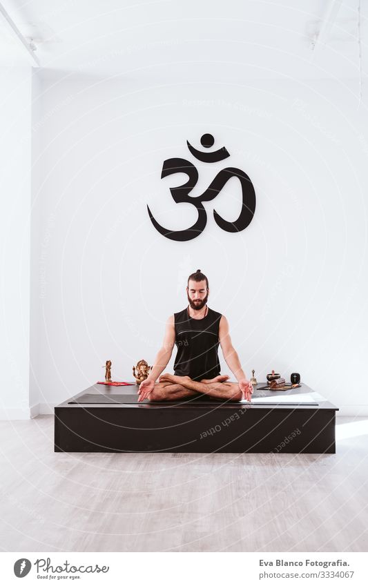 young man practicing yoga sport at the gym. Healthy lifestyle Yoga Man Boy (child) Sports Lifestyle Interior shot Gymnasium Studio shot White hispanic Athletic