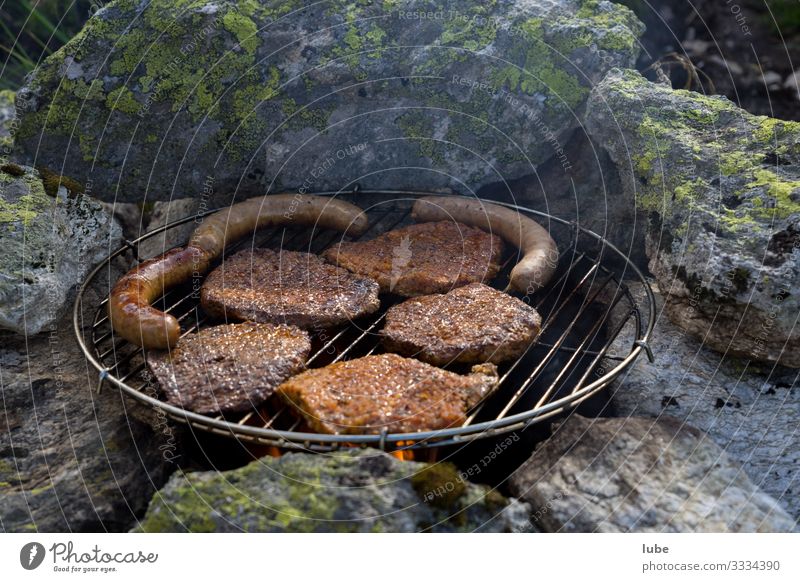 Open air grilling Food Meat Sausage Nutrition Dinner Eating Barbecue (apparatus) Barbecue (event) Meal Steak Meat-eater Exterior shot