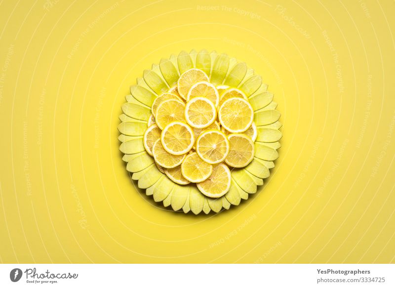 Lemon slices on yellow flower shape plate. Citrus fruits slices Food Fruit Breakfast Plate Healthy Eating Bright above view all yellow detox food flat lay