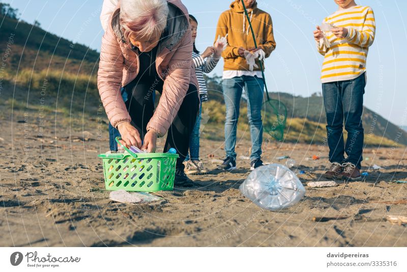 Volunteers preparing to clean the beach Beach Child Human being Boy (child) Woman Adults Man Family & Relations Group Environment Sand Gloves Old Dirty Clean