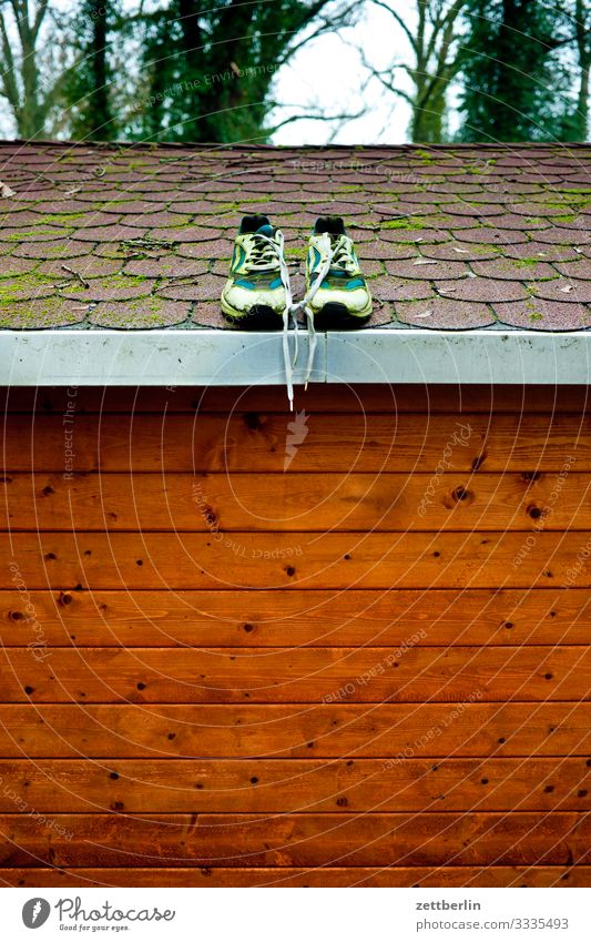 Shoes on the roof Footwear Sneakers In pairs Roof Gardenhouse House (Residential Structure) Hut Scales Storage shed Wooden house Trip Berlin Brandenburg Village