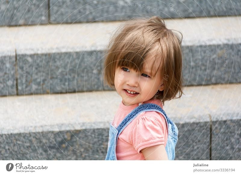 Portrait of baby girl Child Baby Woman Adults Park Blonde Stone White kid European Caucasian two three Lady short hair horizontall wall stairs Colour photo