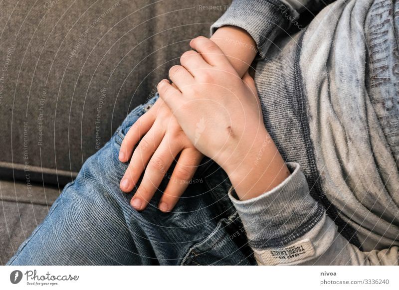Hands of a boy Leisure and hobbies Sofa Entertainment TV set Technology Entertainment electronics Human being Masculine Child Boy (child) Infancy