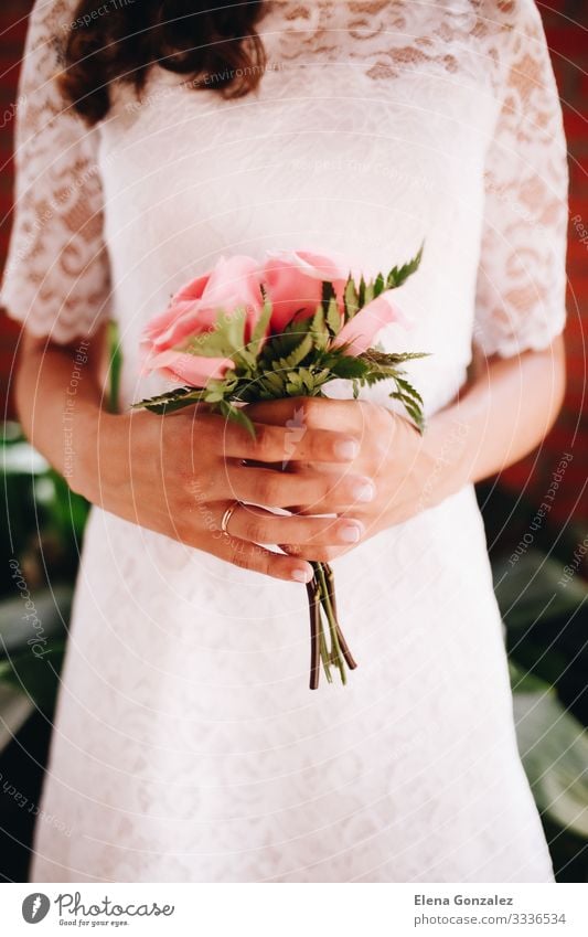 Bride holding her small wedding bouquet of pink roses Wedding Feminine Woman Adults Plant Rose Bouquet Love Together Pink Romance Colour Idea Arrangement