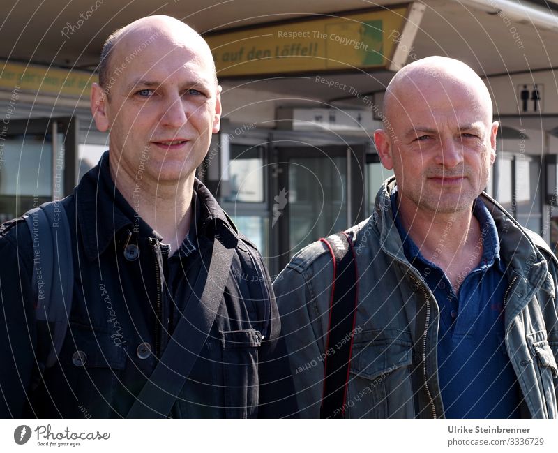 Two men with bald head waiting in the port of Hamburg Vacation & Travel Tourism Trip Adventure Sightseeing City trip Human being Masculine Man Adults Life 2