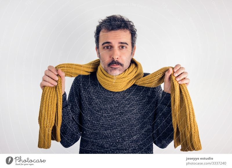 Sad, brunette man with mustache, gray jersey and yellow scarf. Sore throat adult brown care caucasian cold disease expression face fever flu hand headache
