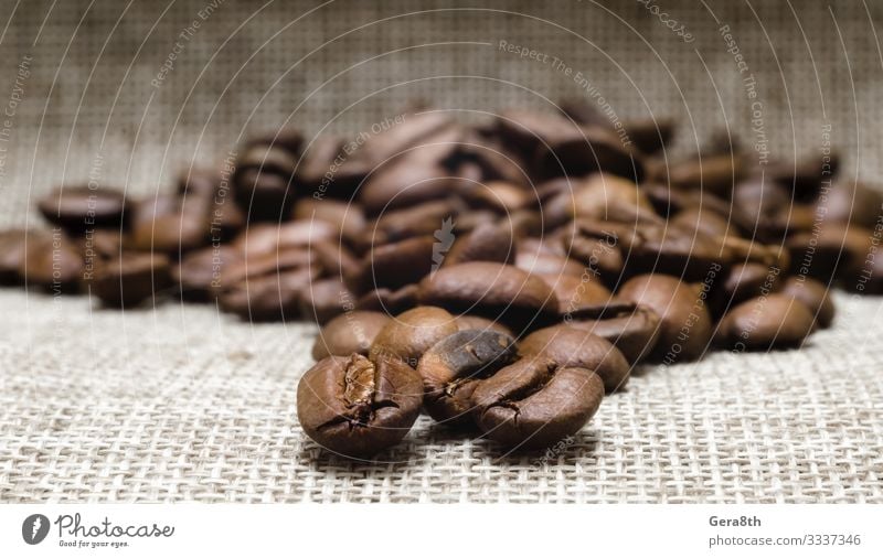 heap of roasted coffee beans on a matting macro Breakfast Coffee Cloth Dark Fresh Natural Brown Black Energy Colour Aromatic backdrop background Beans Beige