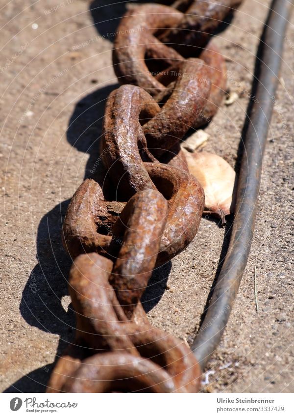 Heavy rusted iron chain in the port Iron Iron chain metal chain Old Rust Lie Harbour Anchor chain Maritime Navigation wharf roasted Chain links ally