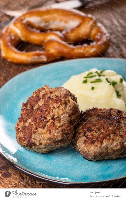 Meatballs on a plate Dinner Plate Gastronomy Warmth Wood Delicious Juicy Blue Brown herbal Meat loaf meatballs Mashed potatoes Minced meat Rustic Ingredients