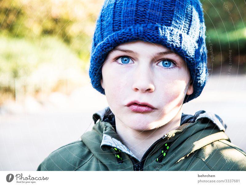 blue cap, blue eyes Cool Cool (slang) Sunlight Intensive portrait Contrast Light Day Lips Mouth Face Nose Eyes Infancy Head Family & Relations Boy (child) Child