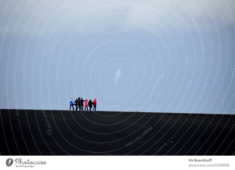 Group of people walking on the dike Ocean Hiking Friendship Sky Wind North Sea Walking Blue Black Safety (feeling of) Loneliness Attachment Colour photo