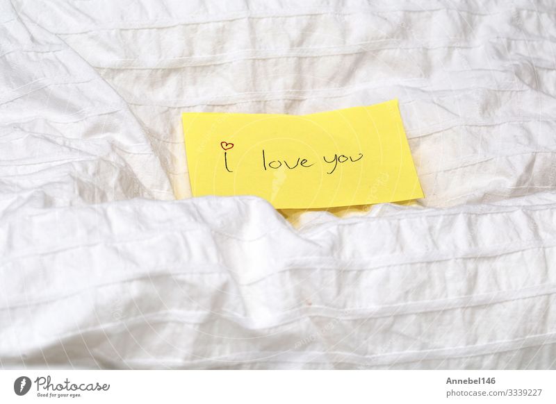 Handwritten little yellow note with the words I love you Happy Beautiful Make-up Table Feasts & Celebrations Valentine's Day Woman Adults Paper Heart Kissing
