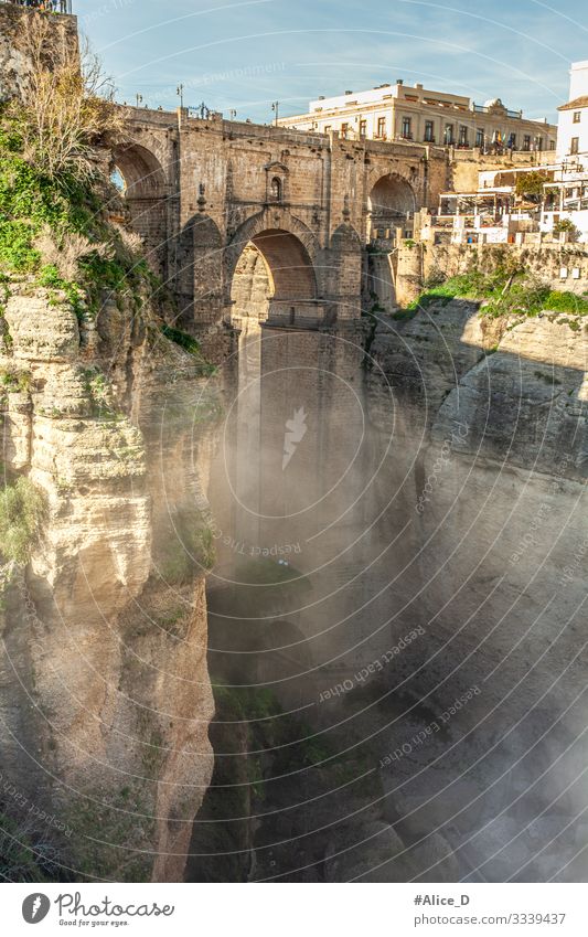 Ronda El Puente Nuevo and El Tajo Gorge Vacation & Travel Sightseeing City trip Fog Rock Canyon Spain Europe Town Old town Bridge Manmade structures