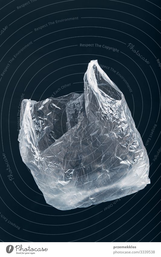 White empty plastic bag floating over black background Shopping Environment Container Plastic Black Environmental pollution Environmental protection Trash