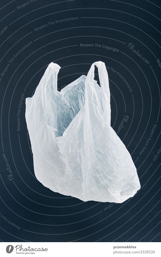 White empty plastic bag floating over black background Shopping Environment Container Packaging Plastic Black Environmental pollution Environmental protection
