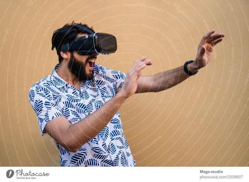 Young Man Using Vr Headset Experiencing Virtual Reality A Royalty Free Stock Photo From Photocase