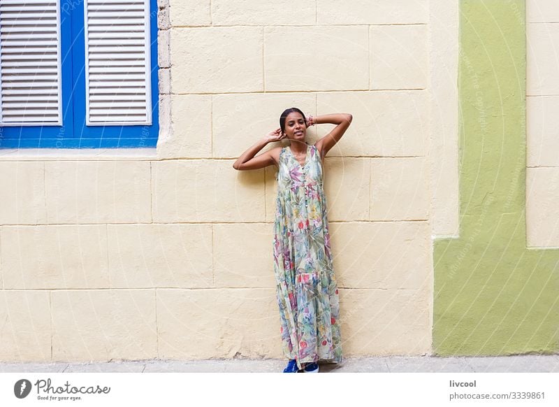 young cuban woman leaning on a wall in havana Lifestyle Happy Island Human being Feminine Young woman Youth (Young adults) Woman Adults Body Skin Head