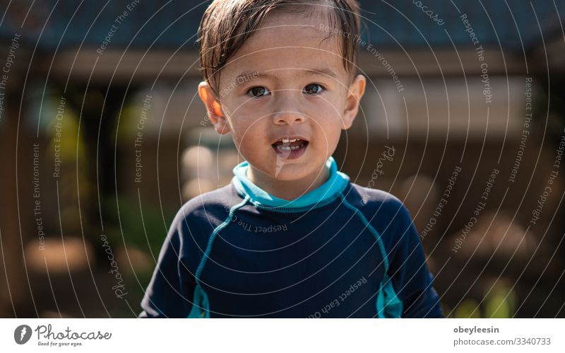 cute young mixed race boy smiling in the sun Joy Happy Face Relaxation Swimming pool Leisure and hobbies Playing Vacation & Travel Summer Sports Success Child