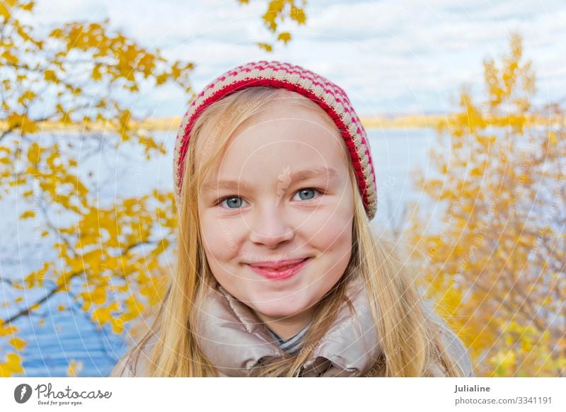 Cute girl in red hat Child Schoolchild Woman Adults Infancy Autumn Hat Blonde Smiling Blue Red White Emotions kid preschooler one Lady six 7 Caucasian European