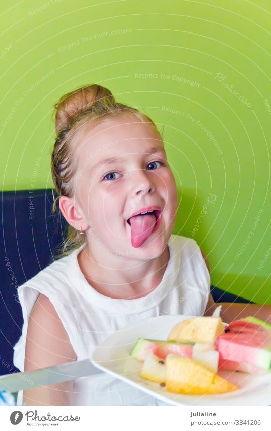Eating girl with put out tongue Child Schoolchild Infancy Mouth Smiling White kid Open preschooler younger six 7 Caucasian European Water melon Melon eight nine