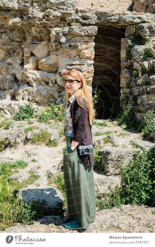 Young female traveler visiting ancient ruins in Tuscany Lifestyle Vacation & Travel Tourism Trip Sightseeing Human being Feminine Young woman